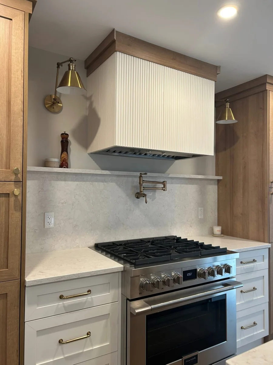 Custom range wall and premium countertop finish in a residential kitchen