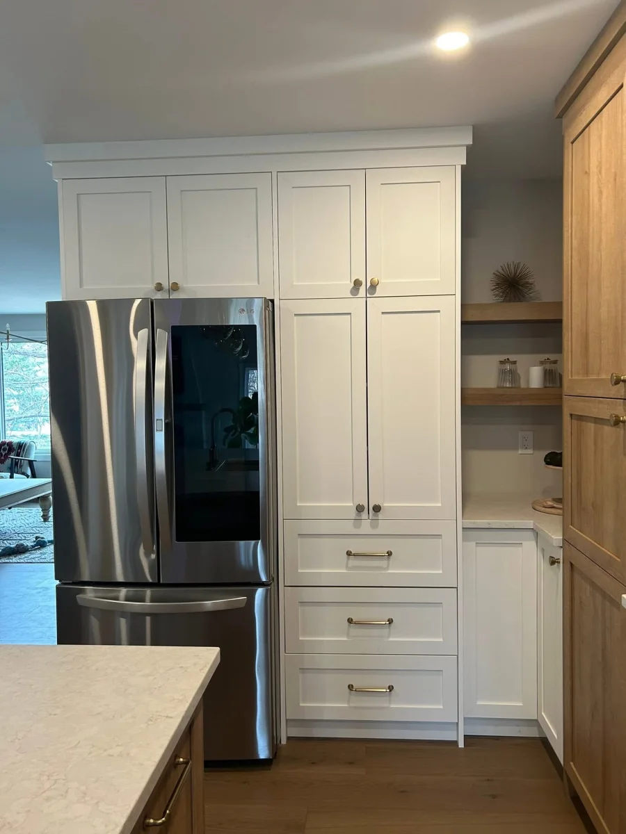 Tall pantry cabinet wall and integrated storage for a kitchen renovation