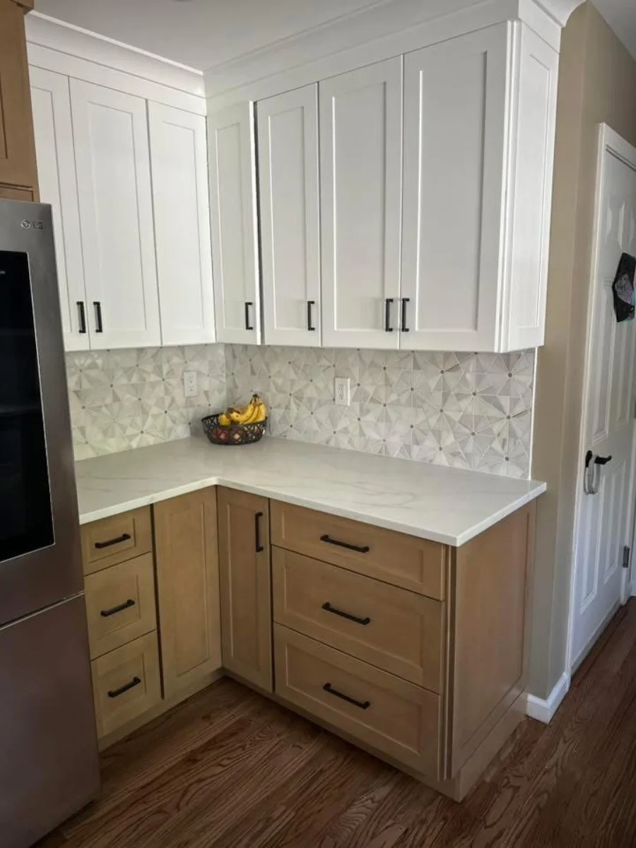Small kitchen renovation with mixed-tone cabinetry and backsplash tile